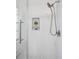 A walk-in shower features subway tile and a glass door at 4970 S Chester St, Greenwood Village, CO 80111