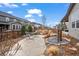 Relaxing backyard featuring a hammock, stone patio and rock garden with water feature at 6220 Waterman Way, Frederick, CO 80516