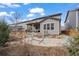 Inviting backyard featuring a comfortable hammock, patio and covered porch at 6220 Waterman Way, Frederick, CO 80516