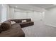 Spacious basement with recessed lighting and a comfortable sectional sofa at 6220 Waterman Way, Frederick, CO 80516