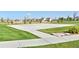Community basketball court with well-maintained concrete surface and grassy surroundings at 6220 Waterman Way, Frederick, CO 80516