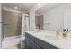 Well-lit bathroom with double sinks, a shower-tub combo, and tasteful decor at 6220 Waterman Way, Frederick, CO 80516