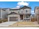 Inviting two-story home showcasing modern architecture, neutral tones, and well-maintained landscaping at 6220 Waterman Way, Frederick, CO 80516