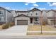 Charming two-story home featuring a neutral color scheme and a well-manicured front yard at 6220 Waterman Way, Frederick, CO 80516
