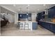 Island kitchen offers seating, recessed lighting, and stylish cabinetry with stainless appliances at 6220 Waterman Way, Frederick, CO 80516