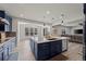 Kitchen seamlessly connects to the living room, offering a breakfast bar for relaxed entertaining and dining at 6220 Waterman Way, Frederick, CO 80516