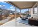 Inviting covered patio with comfortable seating and neighborhood views at 6220 Waterman Way, Frederick, CO 80516