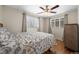 Comfortable bedroom with hardwood floors and two windows offering lots of natural light at 421 Iola St, Aurora, CO 80010