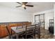 Cozy dining area featuring a ceiling fan, table, and convenient laundry closet for easy living at 421 Iola St, Aurora, CO 80010
