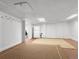 Spacious basement with carpeting and a separate laundry area at 1944 Hudson St, Denver, CO 80220
