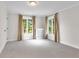 Sunlit bedroom with large windows and neutral carpet at 1944 Hudson St, Denver, CO 80220