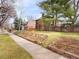 Charming home with beautiful landscaping, a brick exterior, and a lovely garden at 1944 Hudson St, Denver, CO 80220