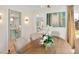 Elegant dining room featuring a wood table, chandelier, and open view to the kitchen at 1944 Hudson St, Denver, CO 80220