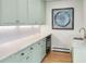 Kitchen with custom cabinets, marble countertops, stainless steel appliances, and under cabinet lighting at 1944 Hudson St, Denver, CO 80220
