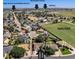 Wonderful aerial view of the neighborhood highlighting the open field, library and recreation center at 1030 S Fulton Ave, Fort Lupton, CO 80621