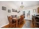 Cozy dining area with wood floors, a chandelier, and a view of the backyard through French doors at 1030 S Fulton Ave, Fort Lupton, CO 80621