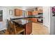 Functional kitchen with ample cabinet space, granite countertops, and an island with bar seating at 1030 S Fulton Ave, Fort Lupton, CO 80621