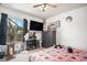 Bedroom features a dresser, ceiling fan, and view from the window at 2782 S Ceylon St, Aurora, CO 80013