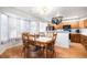 Inviting dining area with wood floors, large windows, and a view into the kitchen at 2782 S Ceylon St, Aurora, CO 80013