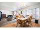 Open concept living space with dining area, living room, and large windows at 2782 S Ceylon St, Aurora, CO 80013