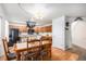 This dining area flows into a kitchen with wood cabinets and modern appliances at 2782 S Ceylon St, Aurora, CO 80013