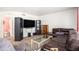 Comfortable living room featuring modern furniture and a view into a partial bathroom at 2782 S Ceylon St, Aurora, CO 80013