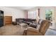 Comfortable living room setup with plush seating, natural light, and a glass-top coffee table at 2782 S Ceylon St, Aurora, CO 80013