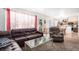 Bright living room and dining area featuring large windows and an open floor plan at 2782 S Ceylon St, Aurora, CO 80013