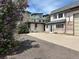 Exterior view of a property with modern row houses and an older building at 5375 W 60Th Ave, Arvada, CO 80003
