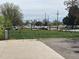 A street view of a lot for sale with passing cars and power lines in the distance at 5375 W 60Th Ave, Arvada, CO 80003