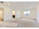 Spacious bedroom with plush carpeting and large windows at 11030 Snowdon St, Parker, CO 80134