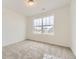 Cozy bedroom with plush carpeting and large window at 11030 Snowdon St, Parker, CO 80134