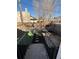 Backyard with artificial grass and an access point via stairs and metal railing at 1853 W 41St Ave, Denver, CO 80211