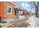 Beautiful red brick house featuring a covered porch and steps to the front door at 1853 W 41St Ave, Denver, CO 80211