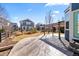 Landscaped backyard with a stamped concrete patio and pergola, perfect for outdoor relaxation and entertaining at 1027 Koss St, Erie, CO 80516