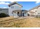 Backyard featuring a pergola with room for dining and a well-maintained lawn at 1027 Koss St, Erie, CO 80516