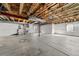 Unfinished basement with open ceiling, concrete floor, white walls and window at 1027 Koss St, Erie, CO 80516