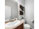 Clean bathroom featuring a sleek vanity, stylish fixtures, and minimalist decor at 1027 Koss St, Erie, CO 80516