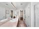 Bathroom featuring dual sinks, granite countertops, and tile floors at 1027 Koss St, Erie, CO 80516