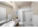 Cozy bathroom features a shower with white tiling and a modern sink with a gray countertop at 1027 Koss St, Erie, CO 80516