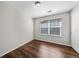 Bedroom features hardwood floors, natural lighting, and a closet with bright white doors at 1027 Koss St, Erie, CO 80516