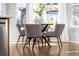 Cozy dining area with elegant table and chairs in a naturally lit space at 1027 Koss St, Erie, CO 80516