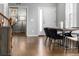 Dining room with hardwood floors, staircase, and modern decor at 1027 Koss St, Erie, CO 80516