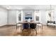 Well-lit dining room with hardwood floors and modern decor at 1027 Koss St, Erie, CO 80516