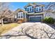 Charming two-story home with a two car garage and stone accents at 1027 Koss St, Erie, CO 80516