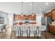 Open kitchen featuring expansive island with bar seating and stainless steel appliances at 1027 Koss St, Erie, CO 80516