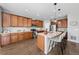 Spacious kitchen featuring a large island with bar seating and wood cabinetry at 1027 Koss St, Erie, CO 80516