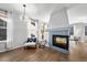 Cozy living room with fireplace and ample natural light at 1027 Koss St, Erie, CO 80516