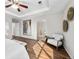 Main bedroom with wood floors, a ceiling fan, seating area and ensuite bathroom at 1027 Koss St, Erie, CO 80516