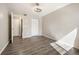 Neutral bedroom featuring wood-look floors, updated fan, and plenty of closet space at 50 S Boulder Cir # 5022, Boulder, CO 80303